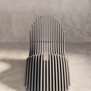 May include: A gray, slatted chair with a curved back and seat. The chair is made of thin, flat pieces of wood that are arranged in a fan shape.