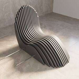 May include: A modern, gray, slatted lounge chair with a curved design. The chair is made of wood and has a minimalist aesthetic.