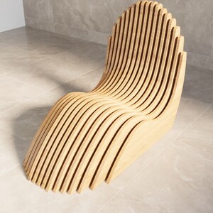 May include: A wooden chair with a unique, curved design. The chair is made of thin, vertical slats of wood that are joined together to create a wave-like shape.