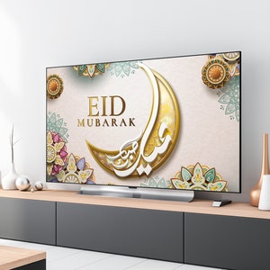 K&ouml;nnte beinhalten: Ein Fernsehbildschirm zeigt einen festlichen Eid Mubarak-Gru&szlig; mit einem Halbmond und komplizierten floralen Designs in Gold, Gr&uuml;n und Rosa.