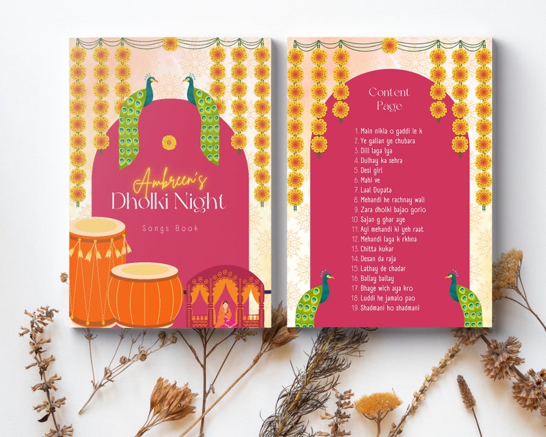 May include: A pink and yellow songbook with a peacock design and the text "Ambreen's Dholki Night Songs Book". The right page lists the songs for the event, including "Main nikla o gaddi le k", "Ye galian ye chubara", "Dill laga Iga", "Dulhay ka sehra", "Desi girl", "Mahi ve", "Laal Dupata", "Mehandi he rachnay wall", "Zara dholki bajao gorio", "Sajan g ghar aye", "Ayi mehandi ki geh raat", "Mehandi laga k rkhna", "Chitta kukar", "Desan da raja", "Lathay de chadar", "Ballay ballay", "Bhage wich aya kro", "Luddi he jamalo pao", and "Shadmani ho shadmani".
