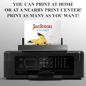 May include: A black printer with a white card in the tray. The card has a yellow Pikachu character and the text "I choosen you Jackson is turning 5".