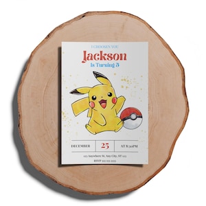 May include: A yellow Pikachu Pokemon character with a red and white Pokeball. The invitation says "I Choosen You Jackson Is Turning 3" with a date of December 25th at 8:30pm. The address is 123 Anywhere St. Any City, ST 123. RSVP 555 555 5555.