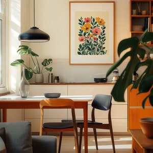 A cosy corner of a neutral wood kitchen with sunlight streaming in. A large framed artwork in on the wall