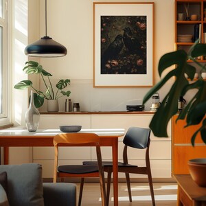 A cosy corner of a neutral wood kitchen with sunlight streaming in. A large framed artwork in on the wall