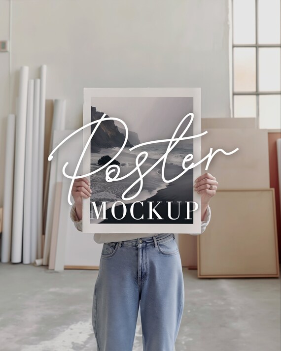 Poster mockup woman PSD, Artist studio mock up with person holding art print, loft modern interior, simple minimal empty blank stock image