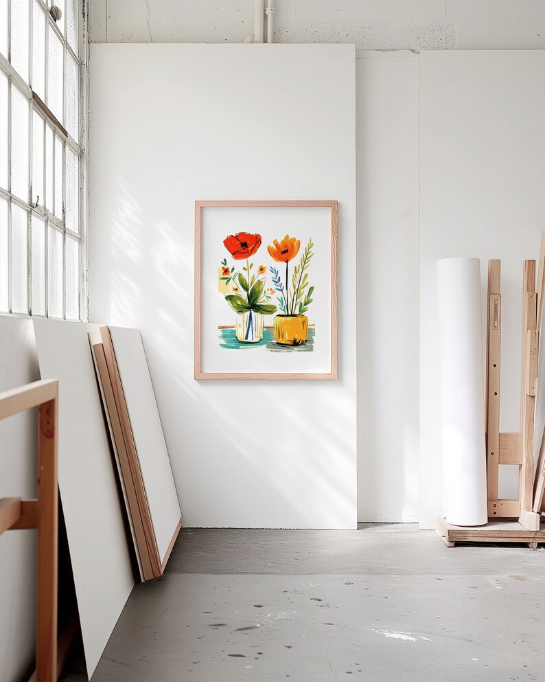 A blank thin oak wood frame mockup, in a minimal bright artist studio, with rolls of art paper and blank canvas