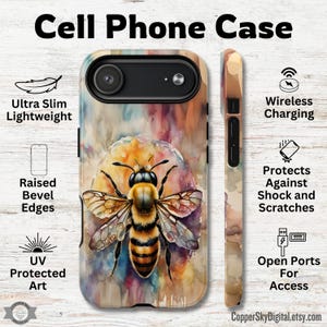 May include: A cell phone case featuring a watercolor painting of a bee. The case has a colorful background with text that reads "Ultra Slim Lightweight", "Raised Bevel Edges", "UV Protected Art", "Wireless Charging", "Protects Against Shock and Scratches", and "Open Ports For Access".
