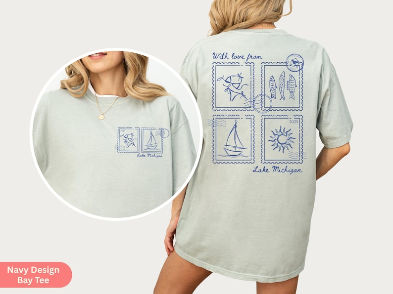 May include: Light green t-shirt with blue stamp-like graphics featuring fish, a sailboat, and a sun. The text "With love from Lake Michigan" is printed on the shirt. The shirt is a relaxed fit.
