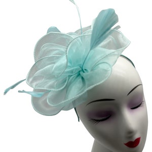 baby blue fascinator hat with headband and clip, wave shaped with feather, for weddings, royal ascot, garden parties and races