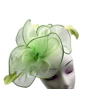 light green fascinator hat with headband and clip, wave shaped with feathers, for weddings, royal ascot, garden parties and races