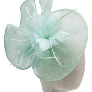 baby blue fascinator wedding hat races ascot derby wavy shaped with headband and clip feathers floral style