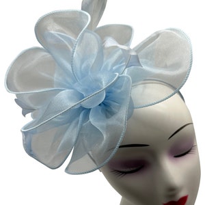 light blue fascinator hat with headband and clip, wave shaped with feathers, for weddings, royal ascot, garden parties and races