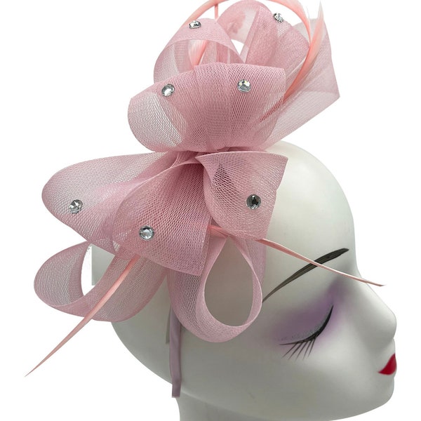 Dull pink fascinator bow shaped with feathers with headband and clip wedding hat hatinator
