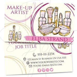 May include: A business card for a makeup artist called Elisa Strand. The card features a pink and gold design with a drawing of makeup brushes, lipstick, and eyeshadow palettes. The text "MAKE-UP ARTIST" is at the top of the card, and the text "YOUR JOB TITLE" is at the bottom. The phone number, address, website, and email address are also included on the card.