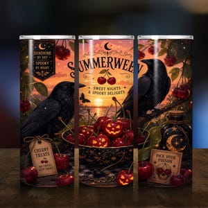 May include: A cylindrical tumbler featuring a sunset scene with black crows, a bowl of cherry-shaped jack-o'-lanterns, and text including "SUMMERWEEN," "SUNSHINE BY DAY SPOOKY BY NIGHT," "CHERRY TREATS," and "PICK YOUR POISON" with a skull illustration.