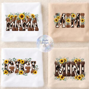 May include: Four folded t-shirts in white and beige featuring block letters spelling MAMA, MIMI, GIGI, and MINI. Each letter has a brown cow print pattern and is decorated with watercolor-style yellow sunflowers and green eucalyptus leaves.