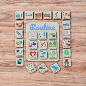 May include: A wooden routine board featuring the word Routine in blue script, surrounded by square tiles with colourful illustrations and text labels for daily tasks like Flossing, Make Bed, Pick Up Toys, Lunch, Get Dressed, Medicine, and more.