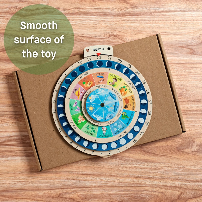 May include: A wooden educational toy depicting the phases of the moon, seasons, and days of the week. The circular design features colorful illustrations and the text "TODAY IS". The toy is packaged in a cardboard box.