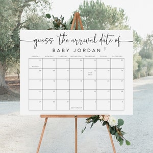 Pu&ograve; includere: Un cartello bianco con un calendario nero su di esso. Il calendario &egrave; per agosto e settembre. Il cartello dice "indovinate la data di arrivo di Baby Jordan".