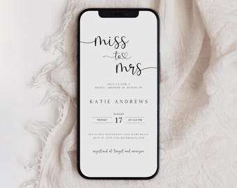 May include: A white smartphone screen displaying a bridal shower invitation for Katie Andrews. The invitation features the text "miss to mrs" in black cursive font with a small heart symbol between the words. The invitation also includes the date, time, and location of the bridal shower.