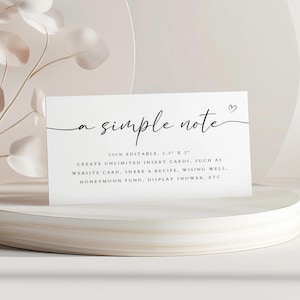 May include: A white card with black text that reads "a simple note" and "100% EDITABLE, 3.5" X 2" CREATE UNLIMITED INSERT CARDS, SUCH AS WEBSITE CARD, SHARE A RECIPE, WISHING WELL. HONEYMOON FUND, DISPLAY SHOWER, ETC".