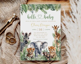 May include: A baby shower invitation with a jungle theme. The invitation features a green leafy border with a heart and the words "hello baby". The text "Join us for a baby shower honoring Oliver Morgan" is in gold lettering. The date and time of the shower are listed as "April 16 | 2:00PM". The invitation also includes the address and RSVP information. The invitation features a zebra, elephant, giraffe, and leopard.
