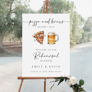 May include: A white sign on a wooden easel with the text "pizza and brews" and "before I do's". Below is a watercolor illustration of pizza and a beer mug. The sign reads "Welcome to our Rehearsal Dinner" and lists names and a date.