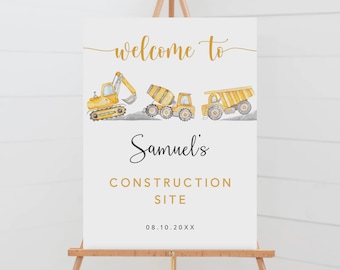 Op de afbeelding: Een wit welkomsbord met de tekst "Welkom op Samuels bouwplaats 08.10.20XX" in gouden letters. Het bord heeft een aquarel-illustratie van drie gele bouwvoertuigen.