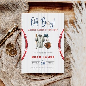 May include: A baseball-themed baby shower invitation with a blue and white striped background. The invitation features a baseball glove, bat, baseball, and a baseball uniform. The text reads "Oh Boy! A Little Slugger Is On The Way" and "Noah James".