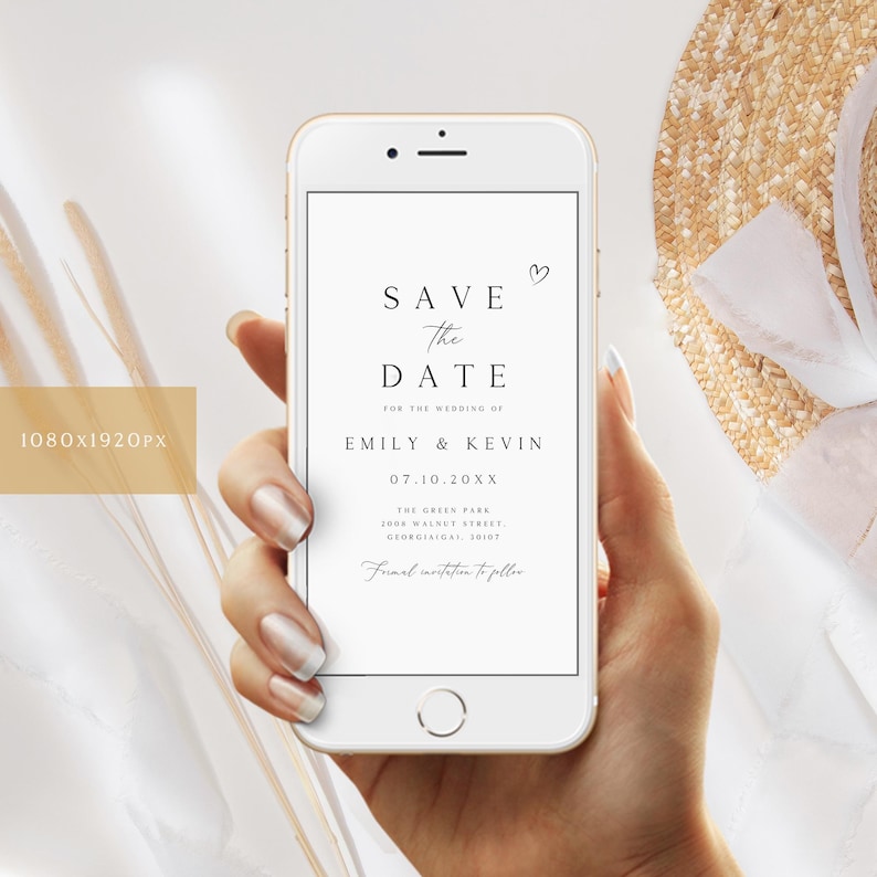 Puede incluir: Una pantalla de tel&eacute;fono inteligente blanca que muestra un anuncio de guardar la fecha para la boda de Emily y Kevin el 10 de julio de 20XX en The Green Park, 2000 Walnut Street, Georgisgal, 30107. El anuncio incluye un peque&ntilde;o icono de coraz&oacute;n.