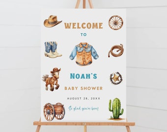 May include: Welcome to Noah's Baby Shower sign with a cowboy hat, boots, a denim shirt, a lasso, a horseshoe, a wagon wheel, a cactus, and a horse. The sign says "Welcome to Noah's Baby Shower, August 28, 20XX, So glad you're here!"