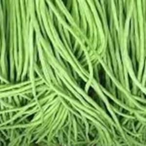 May include: A bunch of long, thin, green string beans. The beans are tightly packed together, creating a textured background.