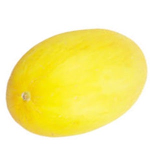 May include: A ripe, yellow honeydew melon against a white background. The oval-shaped melon has a smooth rind and a small stem end. The bright yellow color suggests the melon is ready to eat. The image is well-lit, highlighting the melon's texture and shape.