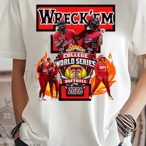 May include: White t-shirt featuring a graphic design with the text "WRECK'EM" in red. The design includes images of softball players in red uniforms, the words "COLLEGE WORLD SERIES SOFTBALL 2026", and flames.