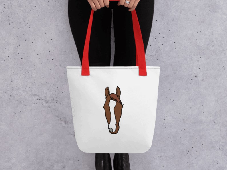 May include: White tote bag with red handles featuring a brown and white horse head illustration.