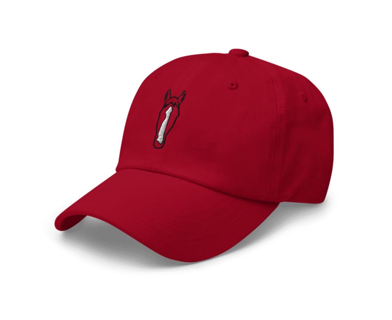 May include: A red baseball cap with an embroidered horse head design.