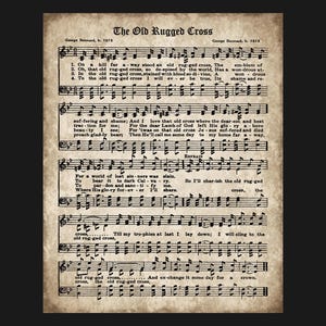 May include: A vintage-style print of the hymn "The Old Rugged Cross" with musical notation and lyrics. The paper has a distressed, aged appearance with the title and composer's name at the top. The text is in black.