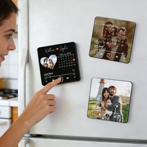 May include: Three square magnets with personalized photos and music player interfaces are displayed on a white fridge. The magnets feature images of couples, a calendar, and the text "Love Story". The magnets are black with white text.