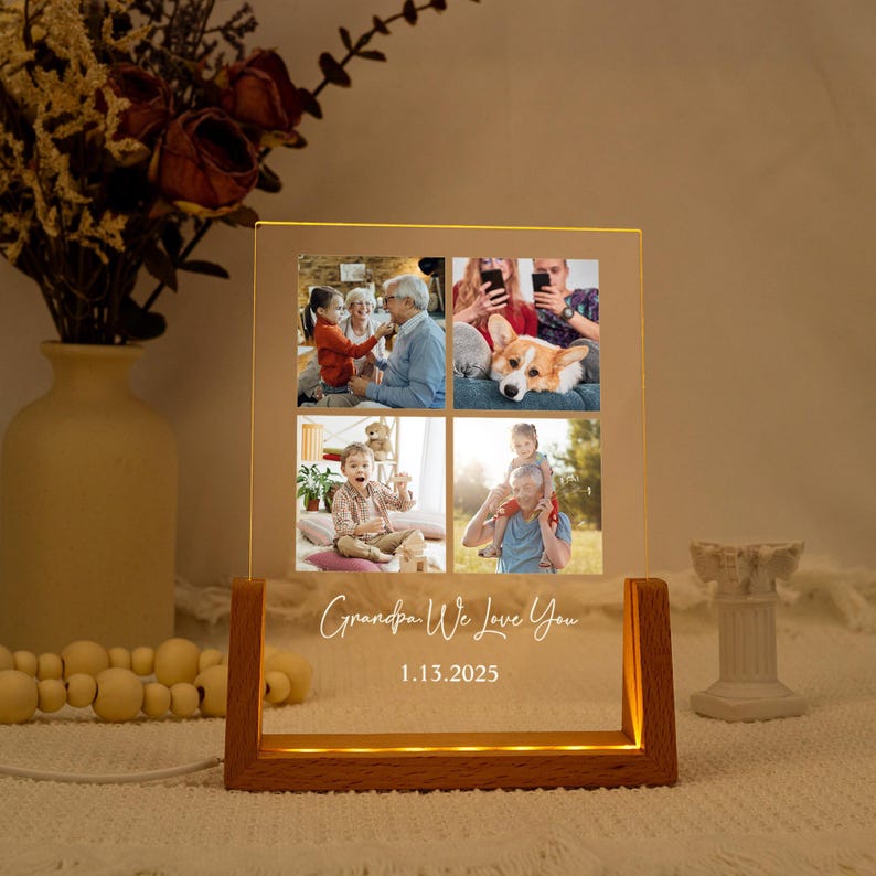 May include: A light-up photo display featuring four family photos. The wooden base emits a warm glow, with the text "Grandpa We Love You" and the date 1.13.2025 illuminated on the front.