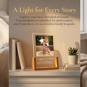 May include: A wooden-based photo display with a warm light, featuring family photos. The display reads "A Light for Every Story". The illuminated images create a cosy atmosphere. Ideal for home decoration.