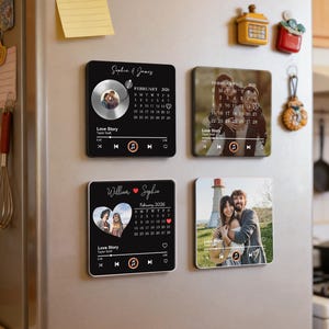 May include: Four square magnets with personalized designs are displayed on a refrigerator. Each magnet features a photo, a calendar, and a music player interface. The magnets are black and white with a modern aesthetic.
