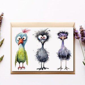 May include: A greeting card featuring three cartoon birds with large eyes. The birds are drawn in a watercolor style and have different colors and features. The card is blank inside for writing a message.