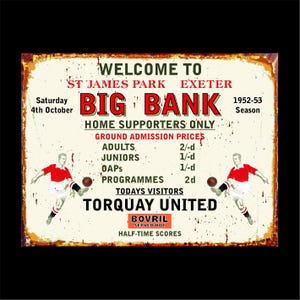 May include: A vintage metal sign advertising a football match at St James Park, Exeter, with the text "Big Bank" and "Torquay United." The sign displays admission prices and the date, 4th October, 1952-53 season. Two football players are shown.