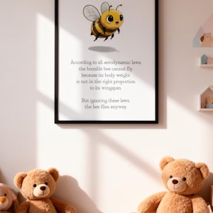 May include: A framed print featuring a cartoon bumblebee with the text: "According to all aerodynamic laws, the bumble bee cannot fly...But ignoring these laws, the bee flies anyway." Two teddy bears sit below.