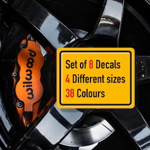 May include: Set of 8 decals in 38 colors and 4 different sizes. The decals are yellow with black text. The text reads "Set of 8 Decals", "4 Different sizes", and "38 Colours".