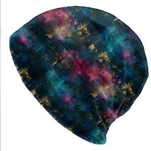 May include: A set of three ceramic mugs with a speckled, matte finish. The mugs are in shades of cream, light gray, and dark gray. Each mug has a simple, minimalist design and a rounded handle.