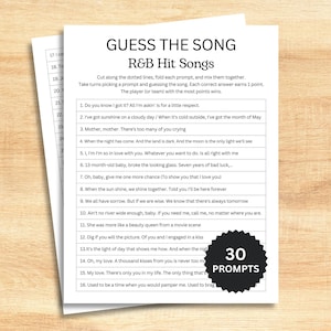 May include: A printed game sheet titled "GUESS THE SONG" with R&B Hit Songs prompts. The sheet includes instructions and numbered song prompts. A black and white circular badge with "30 PROMPTS" is on the right side.