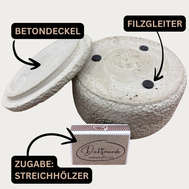 May include: A light gray concrete container with a matching lid and a box of matches. The container has a textured surface and three black felt pads on the bottom. The lid is slightly ajar, revealing the interior.