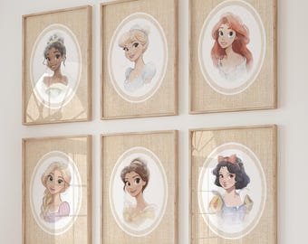 May include: Six framed watercolor portraits of Disney princesses hang on a white wall above a wooden storage unit with white bins. The room is decorated with pillows, a giraffe-shaped wicker sculpture, and a garland.